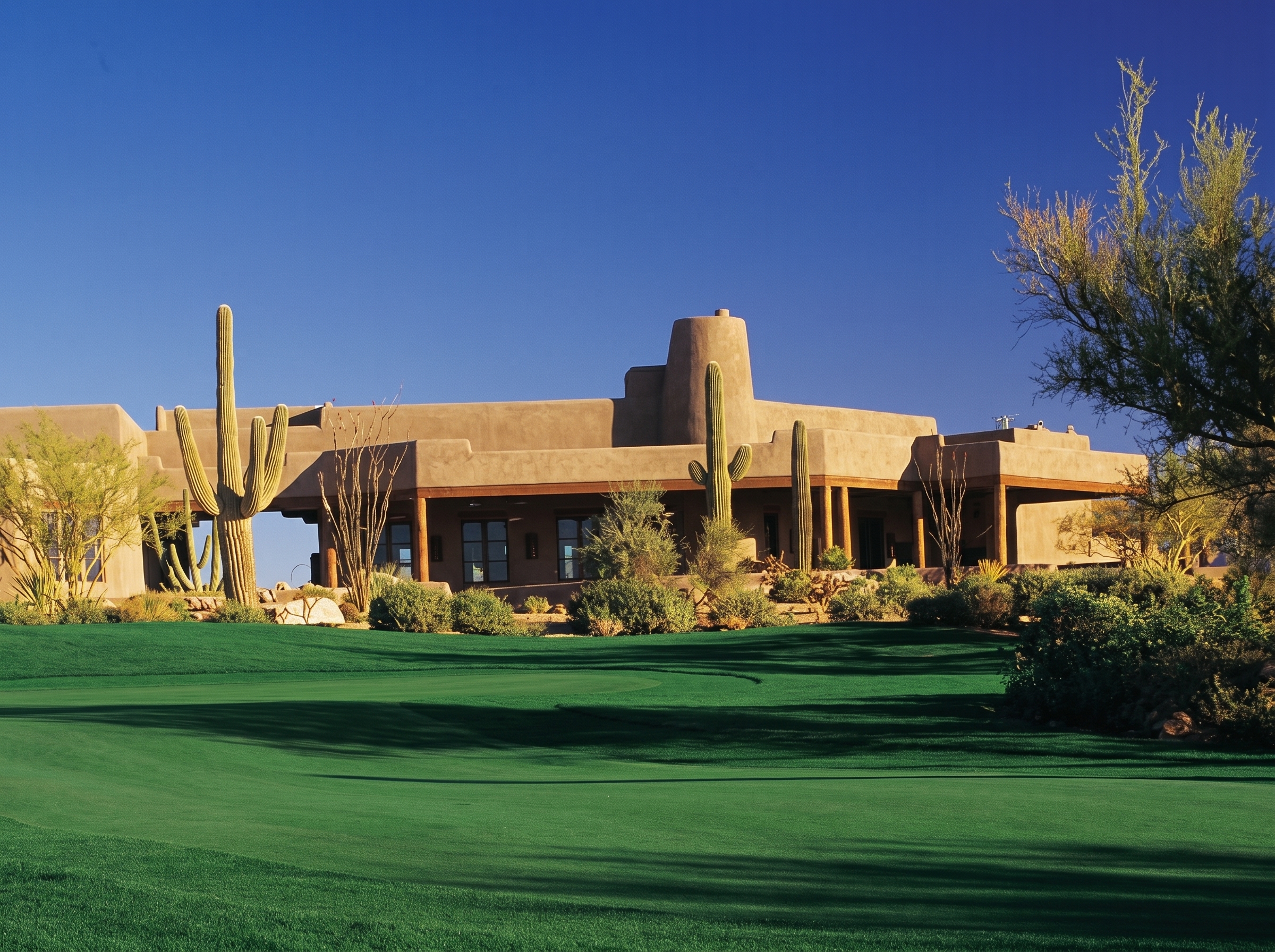 The Southwestern adobe clubhouse at Legend Trail Golf Club viewed from the fairway, North Scottsdale, Arizona