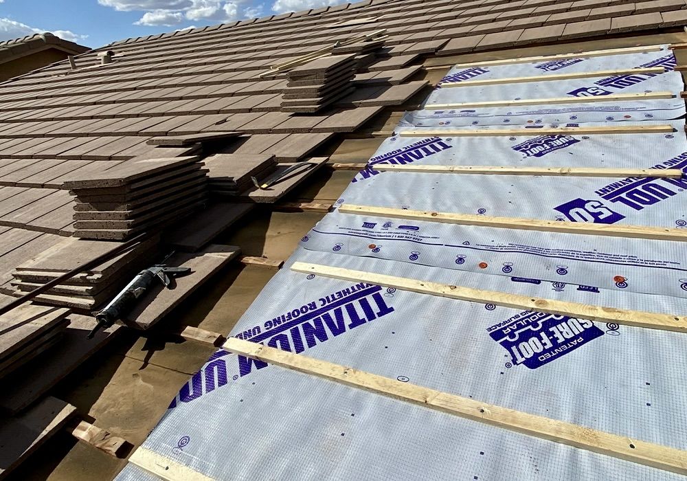 New synthetic underlayment being installed beneath existing tile, Rio Verde, Arizona